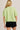 Back view of model wearing green short sleeve sweater cardigan
