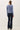 Back view of model wearing blue Ultra Soft Essential Basic Crewneck Button Up Cardigan with pants