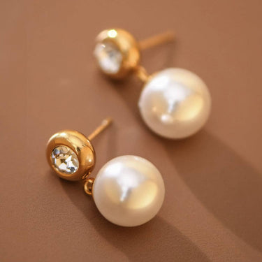 18K Gold PVD Plated Waterproof Stainless Steel Drop Earrings 7774 displayed as a pair on a brown background
