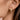 18K Gold Plated Waterproof Stainless Steel Hoop Earrings 7112 worn on a model's ear