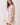Floral Print Sleeveless Tiered Babydoll Dress worn by a model showcasing its relaxed babydoll silhouette and tiered skirt.