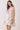 Floral Print Sleeveless Tiered Babydoll Dress worn by a model showcasing its relaxed babydoll silhouette and tiered skirt.