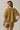 Back view of model wearing mustard yellow short sleeve sweater cardigan