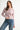 Pearl Button Ribbed Knit Cardigan in pink styled with denim jeans