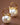 18K Gold PVD Plated Stainless Steel Pearl Drop Earrings 8036 displayed vertically on a brown background