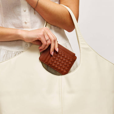 Bryer Card Holder Chocolate held in hand, showcasing its compact design.