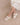 The Polly Cream Ruffle Strap Raffia Platform Slide Sandal worn with a floral dress, showcasing its playful ruffle design.