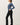 Ribbed Button Up Cardigan side view in blue with black pants