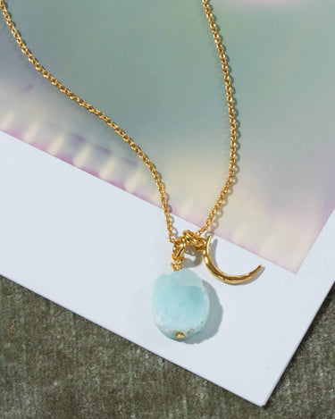 Celestial Being Necklace- Larimar featuring a larimar pendant and gold chain, perfect for layering.