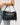 Waylon Shoulder Bag Chocolate in black with a stylish shoulder strap.