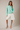 Model wearing mint green Round Rolled Hemline Detail Thin Sweater Cardigan with white shorts