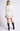 Chiara white long-sleeve pullover sweater on model, three-quarter back view