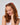 Girl smiling with reddish-brown hair styled using Recycled Mini Cloud Clips 8pc Set - Assorted Cherry Blossom.