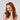 Girl smiling with reddish-brown hair styled using Recycled Mini Cloud Clips 8pc Set - Assorted Cherry Blossom.
