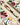DreamWrite Bloom Pen in decorative gift tube featuring floral illustrations and smooth black ink tip.