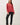 Model wearing red raglan sleeve slub pullover sweater with black pants, front view