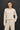 Front view of model wearing stone cotton modal fleece sweatshirt with matching pants