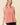 Model wearing a Striped Yoke Top in pink, showcasing the design and fit with a relaxed silhouette.
