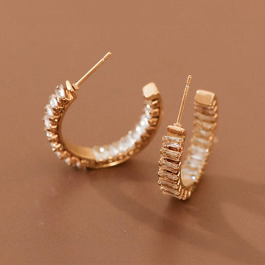 18K Gold Plated Stainless Steel Rhinestone Hoop Earrings 7983 displayed as a pair on a brown background
