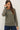 Model wearing olive green raglan sleeve slub pullover sweater