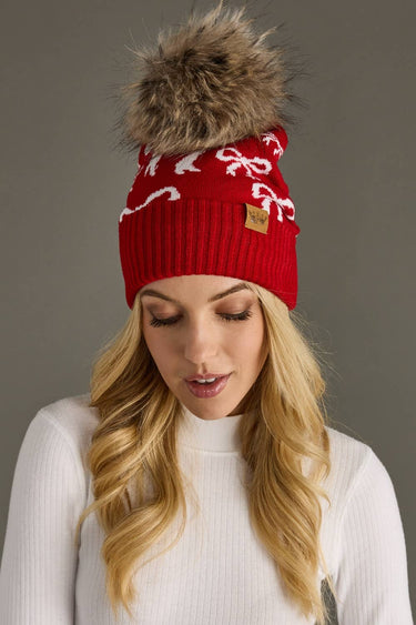 Red and white pom pom hat