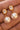 18K Gold PVD Plated Waterproof Stainless Steel Drop Earrings 7774 close-up showing pearl accents and gold details