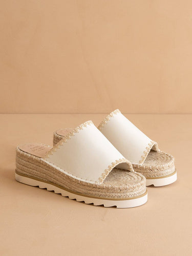 The Vista White Espadrille Platform Summer Sandal with vegan leather and espadrille sole on a beige background.