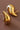 18K Gold Plated Waterproof Stainless Steel Stud Earrings 7080 displayed as a pair against a dark brown background