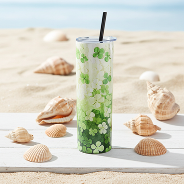 Clovers St. Patrick's Day Tumbler Shamrock Tumbler surrounded by seashells on a beach.