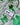 Shamrock Clay Studs Shamrock Stud Earrings displayed on a green mesh background with clover patterns.