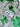 Shamrock Clay Studs Shamrock Stud Earrings displayed on a green mesh background with clover patterns.