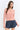 Pearl Button Ribbed Knit Cardigan styled with denim shorts for a casual look