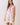 Floral Print Sleeveless Tiered Babydoll Dress worn by a model with a relaxed silhouette and vibrant floral design.