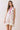 Floral Print Sleeveless Tiered Babydoll Dress worn by a model with a relaxed silhouette and vibrant floral design.