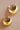 18K Gold Plated Waterproof Stainless Steel Hoop Earrings 7463 showcasing the rounded design from an angled view