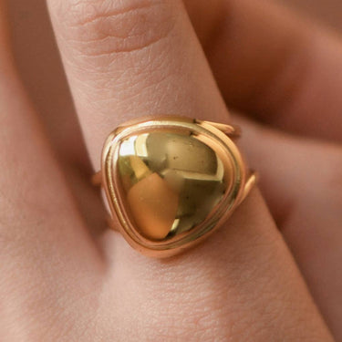 18K Gold Plated Waterproof Stainless Steel Ring 7964 worn on a finger, showing its decorative gold design