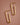18K Gold Plated Waterproof Stainless Steel Hoop Earrings 6977 displayed on a brown background