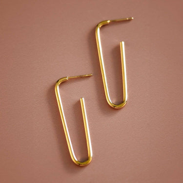 18K Gold Plated Waterproof Stainless Steel Hoop Earrings 6977 displayed on a brown background