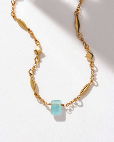 Prism Gems Birthstone Necklace - March featuring aquamarine and gold-plated starburst chain.