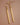 18K Gold Plated Waterproof Stainless Steel Drop Earrings 6976 displayed as a pair on a brown background