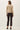 Back view of model wearing beige Ultra Soft Essential Basic Crewneck Button Up Cardigan
