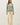 Front view of model wearing sage green raglan pullover sweater