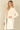 Shop Wall open front long sleeve cardigan in cream with side pockets worn by a blonde model