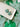 Two Tone Shamrock Earrings Clover Clay Earrings displayed on a tray with green fabric in the background.