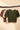 Cream ribbed knit top folded flat showing the garment design