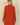 Back view of Shop Wall rust orange long sleeve open front cardigan with side pockets on a model