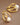 18K Gold PVD Plated Waterproof Stainless Steel Hoop Earrings 7193 displayed against a brown background