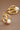 18K Gold PVD Plated Waterproof Stainless Steel Hoop Earrings 7193 displayed against a brown background