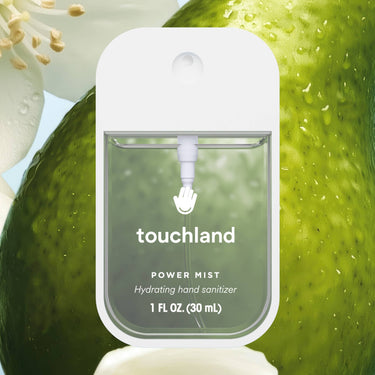 Rainwater Power Mist Hydrating Hand Sanitizer bottle with fresh green background