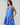 Kaidy Tropical Loly Trapeze Mini Dress featuring a ruffle trim sleeveless design in a vibrant blue pattern.
